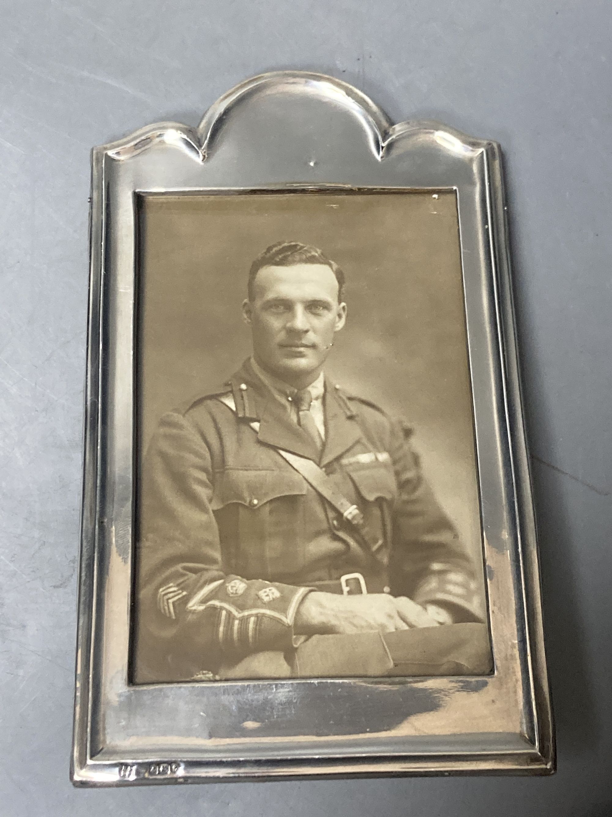 A pair of George V silver mounted photograph frames, Boots Pure Drug Company, Birmingham, 1918, 19.5cm & 1 other frame.